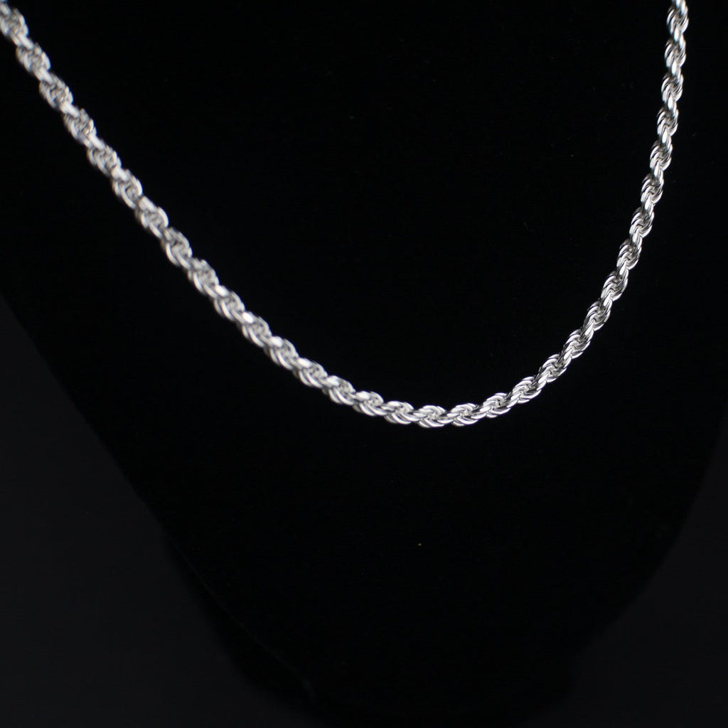 Silver rope chain on a black background